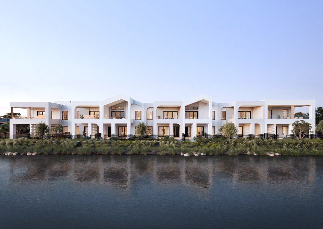 Waterfront residences at The Point, Point Lonsdale, seen across the waterway at golden hour