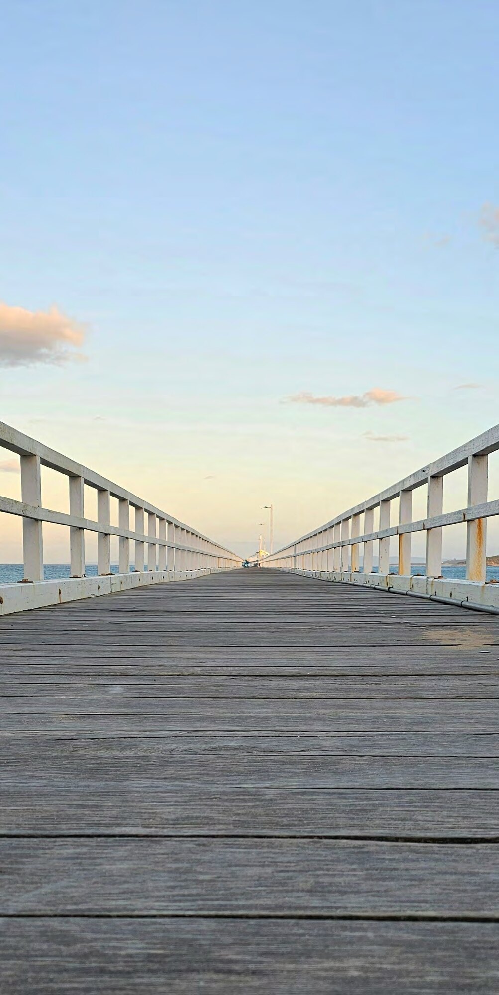 Point Lonsdale pier reaching into the bay at sunset